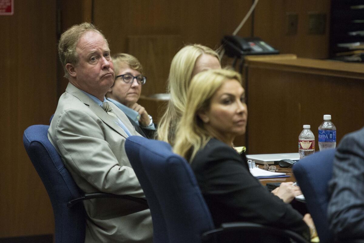 Douglas Gordon Bradford watches as the prosecutor, Deputy Dist. Atty. John Lewin, makes his opening remarks Bradford's murder trial. He was convicted of killing Lynne Knight in 1979 Thursday.