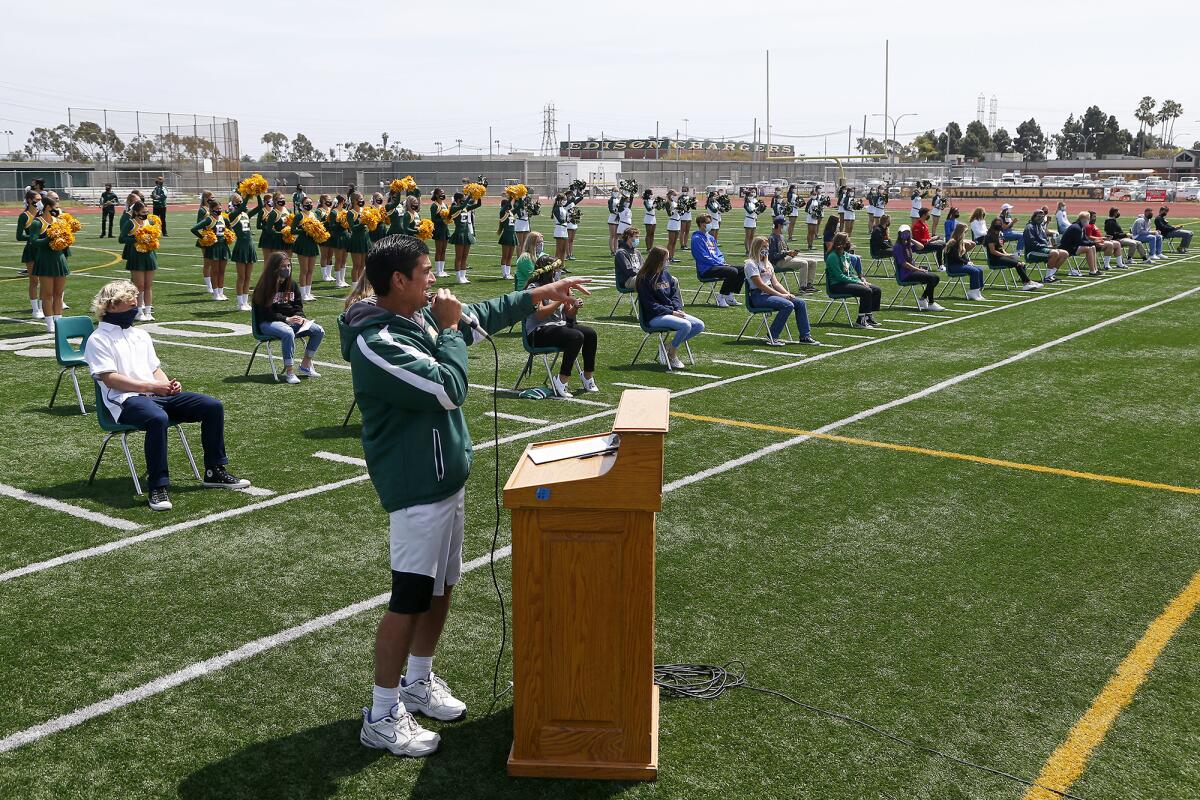 Edison athletic director Rich Boyce speaks during a spring signing day ceremony.