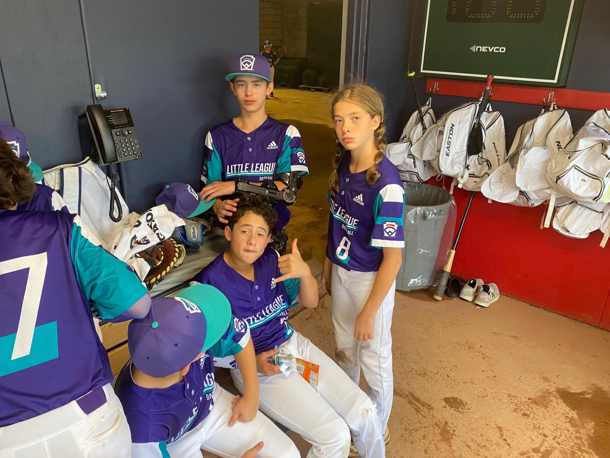 Ella Bruning waits during a rain delay with her Wylie teammates.