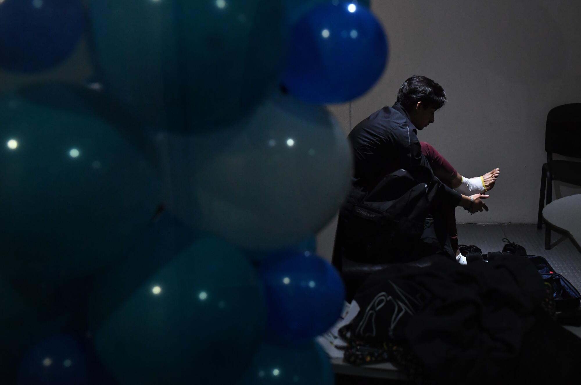 Mexican figure skater Donovan Carrillo wraps his feet before practice.