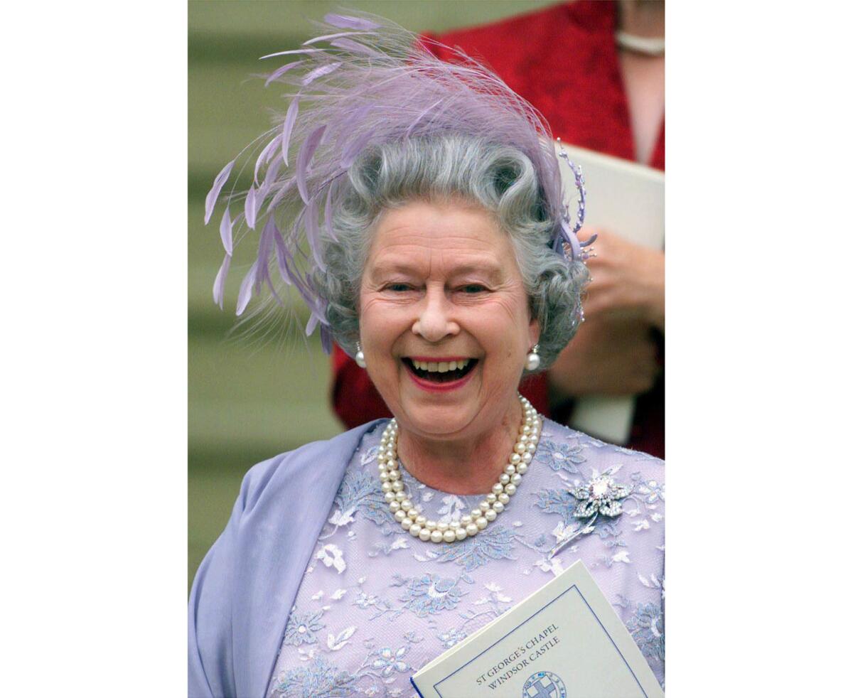 June 19, 1999: Queen Elizabeth II of England laughs as she leaves St George's Chapel in Windsor Castle after the wedding of her son Prince Edward and Sophie Rhys-Jones.