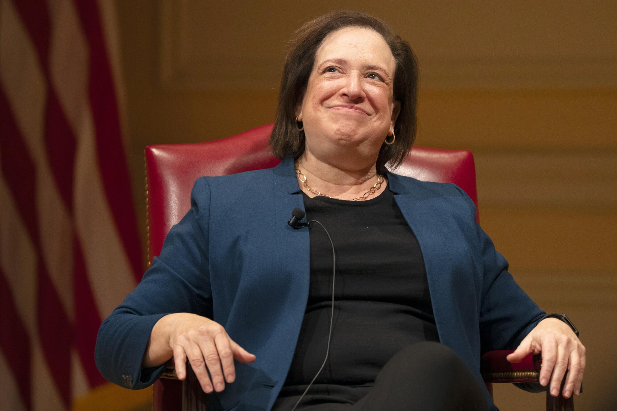 U.S. Supreme Court Justice Elena Kagan, seated and wearing a blue jacket.