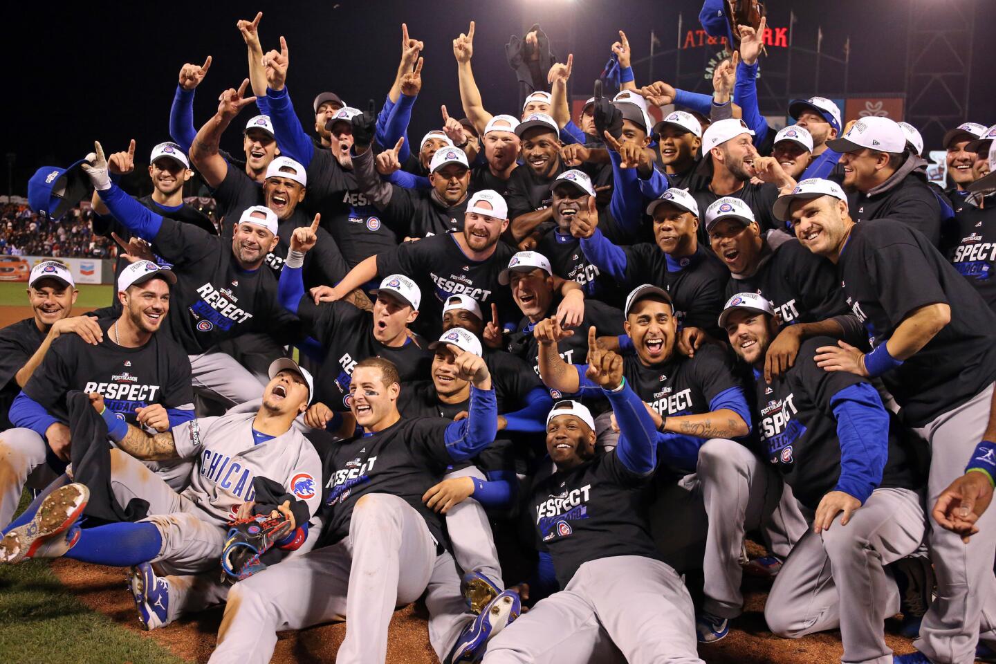 The Cubs celebrate their win in Game 4 of their National League Division Series.