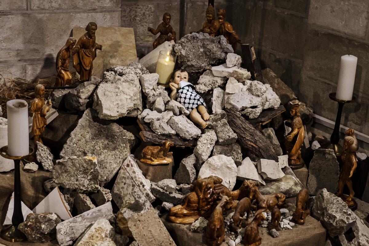 A nativity scene in Bethlehem with the symbolic Baby Jesus in a manger of rubble.