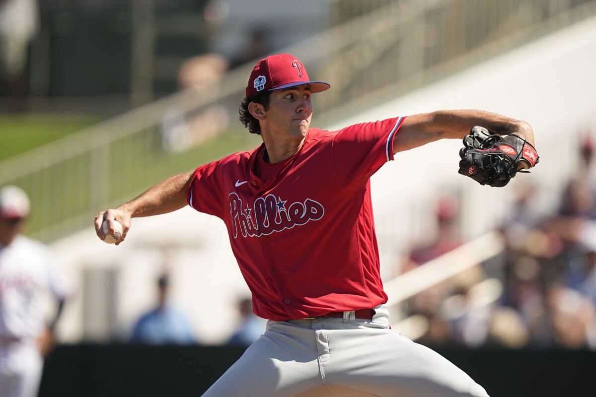 Philadelphia Phillies' pitcher Andrew Painter, delivers in the first inning during a spring training baseball game against the Minnesota Twins, Wednesday, March 1, 2023, in Fort Myers, Fla. (AP Photo/Brynn Anderson)