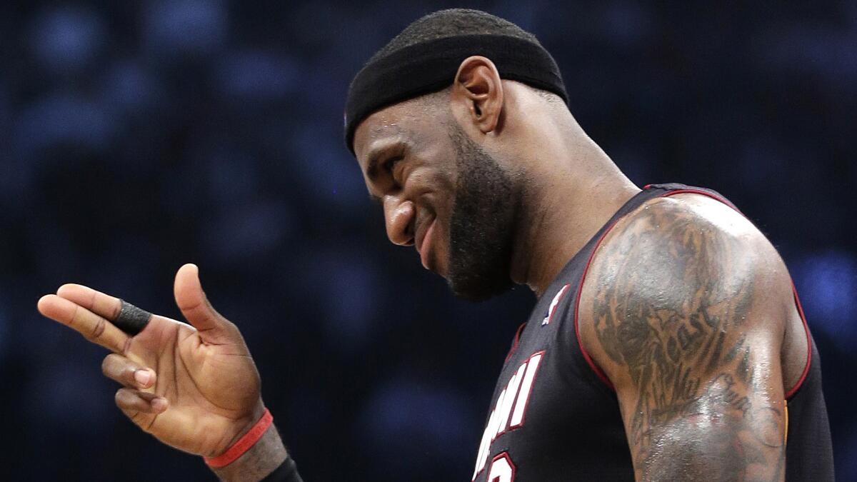 LeBron James gestures during a playoff game against the Brooklyn Nets in May. By convincing James to return, the Cleveland Cavaliers were the biggest winners in NBA free agency.