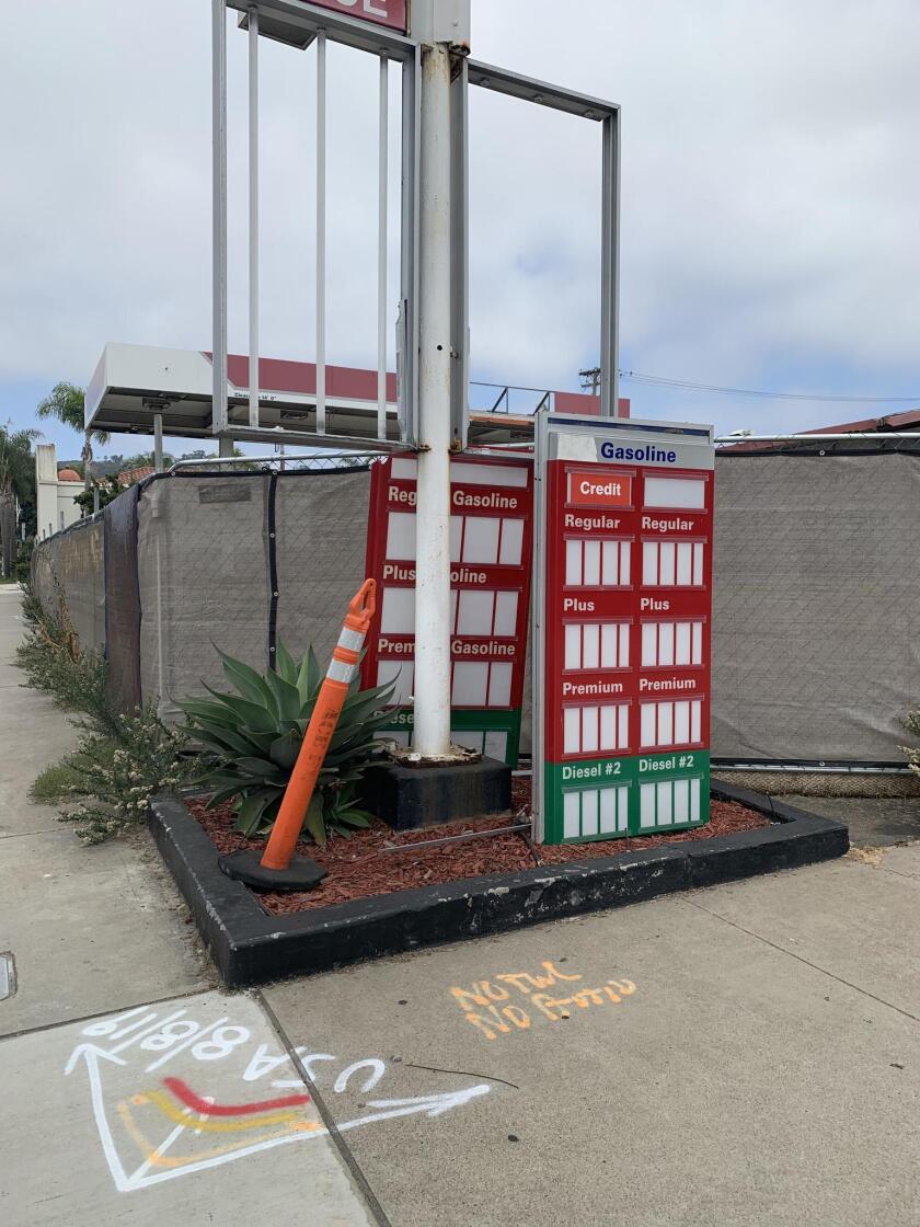 The 76 gas station on Pearl Street closed in September 2018. The property is now surrounded by a tarp-covered, chain-link fence — along with overgrown weeds — and its former signage is falling apart.