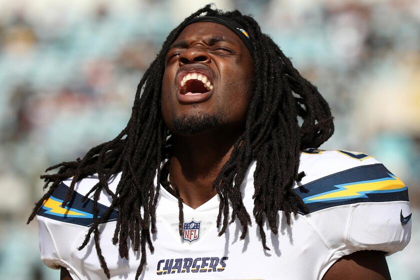 Chargers' Melvin Gordon waits on the field during the first half of their game against the Jacksonville Jaguars.