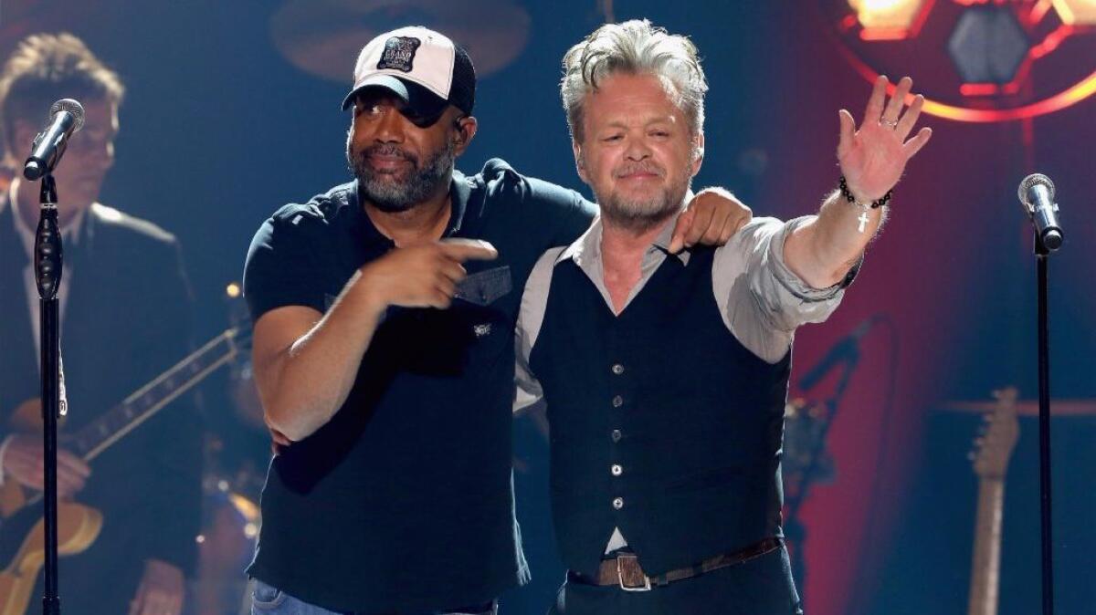 Darius Rucker, left, and John Mellencamp performed together for a "CMT Crossroads" special.