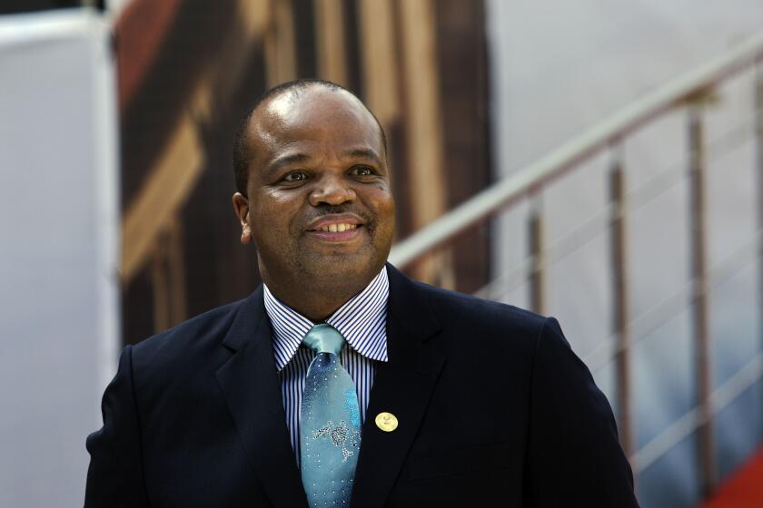 FILE - King Mswati III of Eswatini arrives for the swearing-in ceremony of Cyril Ramaphosa at Loftus Versfeld stadium in Pretoria, South Africa, on May 25, 2019. The small southern African nation of Eswatini was holding elections Friday Sept. 29, 2023 to decide part of the makeup of its parliament, even as the extremely wealthy king retains absolute power, political parties are banned and elected representatives can merely advise a monarch whose family has reigned supreme for 55 years. (AP Photo/Jerome Delay, File)