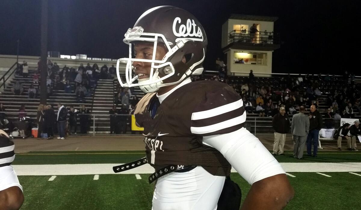 Crespi senior Marvell Tell prepares to warm up before Friday night's playoff game against Santa Margarita.