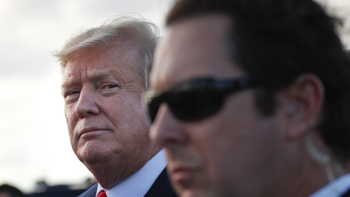 President Trump, shown arriving in Palm Beach, Fla., over Easter weekend, and his business organization are suing the Democratic chairman of the House Oversight Committee.