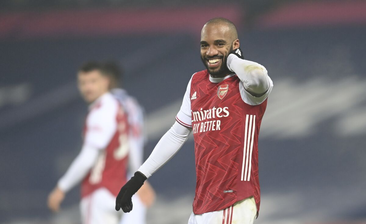 Arsenal's Alexandre Lacazette celebrates after scoring his sides 4th goal of the game during the English Premier League soccer match between West Bromwich Albion and Arsenal at the Hawthorns in Birmingham, England, Saturday, Jan. 2, 2021. (Michael Regan/ Pool via AP)
