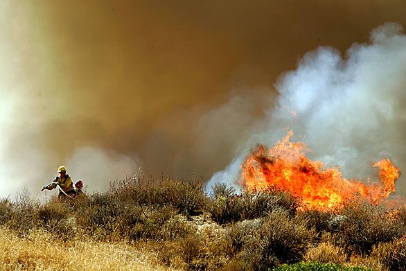 U.S. Forest Service firefighters attack the blaze near the services Biedebach Regional Training Center.