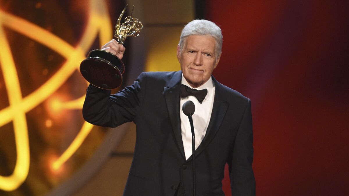 Alex Trebek with his award for game show host for "Jeopardy!" at the Daytime Emmy Awards in 2019.