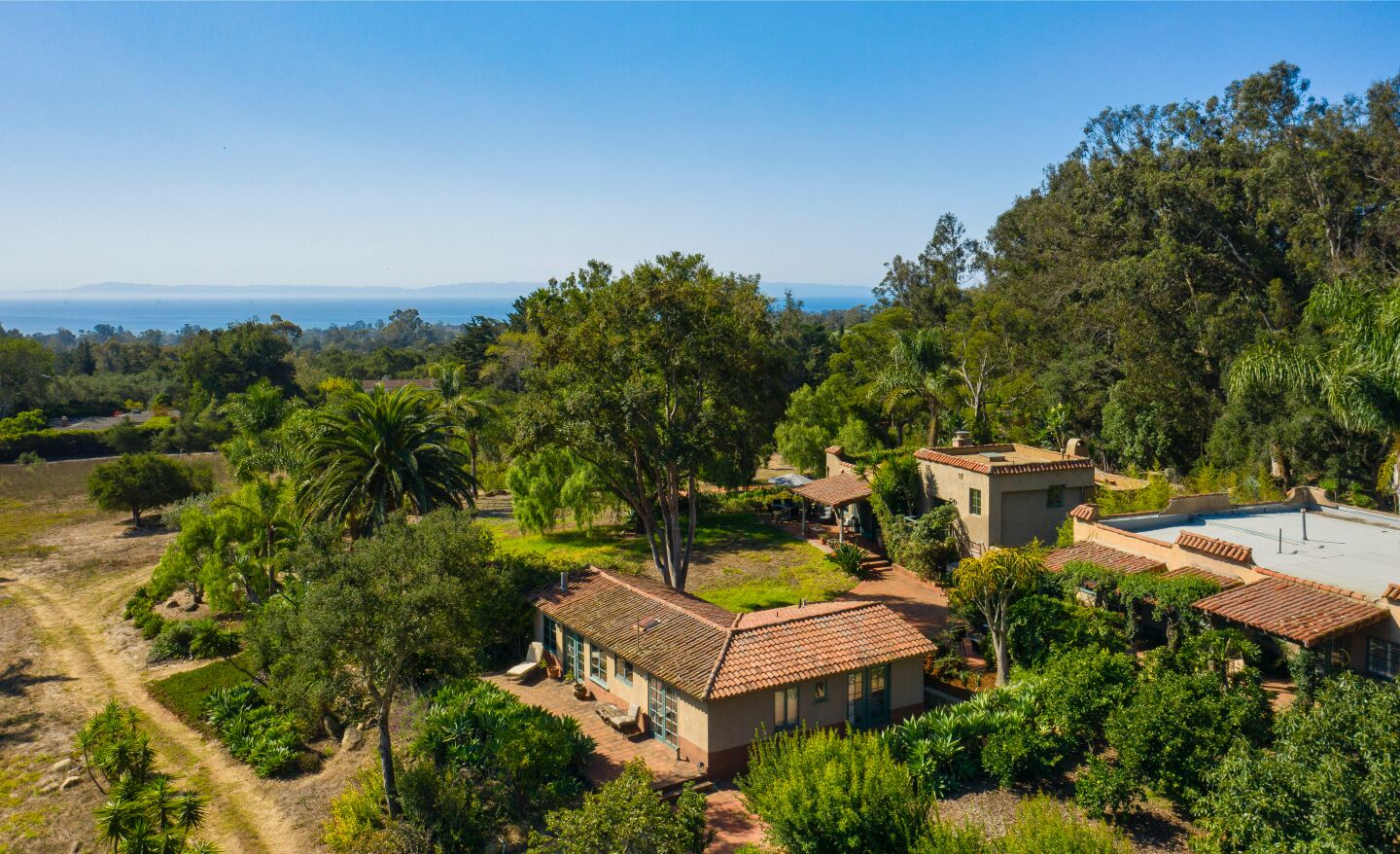 Spanning 13 acres in the Santa Ynez Mountains, the compound holds three structures, a swimming pool and tennis court.