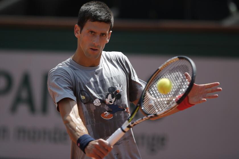 Novak Djokovic returns the ball during a training session for the French Open.