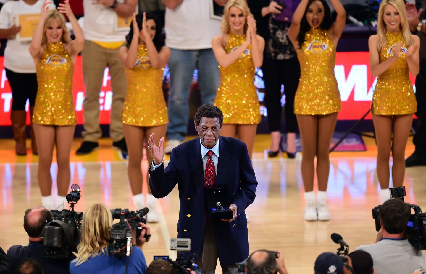 NBA legend and former Laker Elgin Baylor acknowledges the crowd upon reception of an award at halftime during the Los Angeles Lakers v Golden State Warriors NBA game at Staples Center in Los Angeles, California on November 16, 2014, where the Warriors defeated the Lakers 136-115.