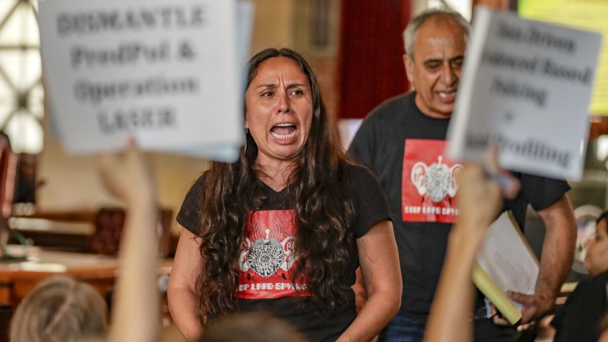 Jamie Garcia, left, and Hamid Khan of Stop LAPD Spying Coalition oppose the LAPD's use of a data program that predicts the locations of property-based crimes.