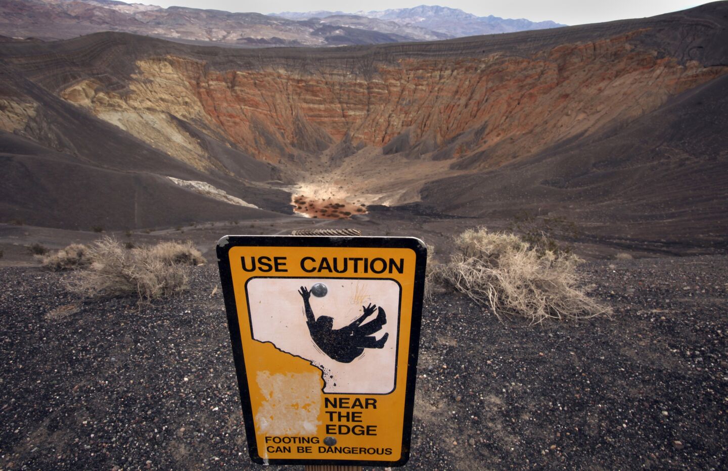 The 600-foot deep Ubehebe Crater is located in the northern area of Death Valley, where a powerful volcanic steam explosion created the the colorful hole in the ground suitable for hiking.