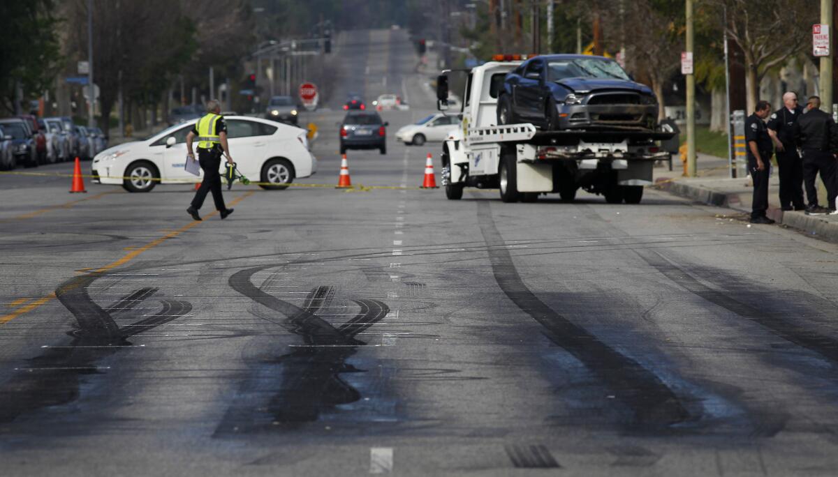 Skid marks are seen at the spot of a street race that ended in the deaths of two pedestrians in Chatsworth in February. A planned street race in Santa Clarita recently was foiled due to an Instagram post, authorities said.