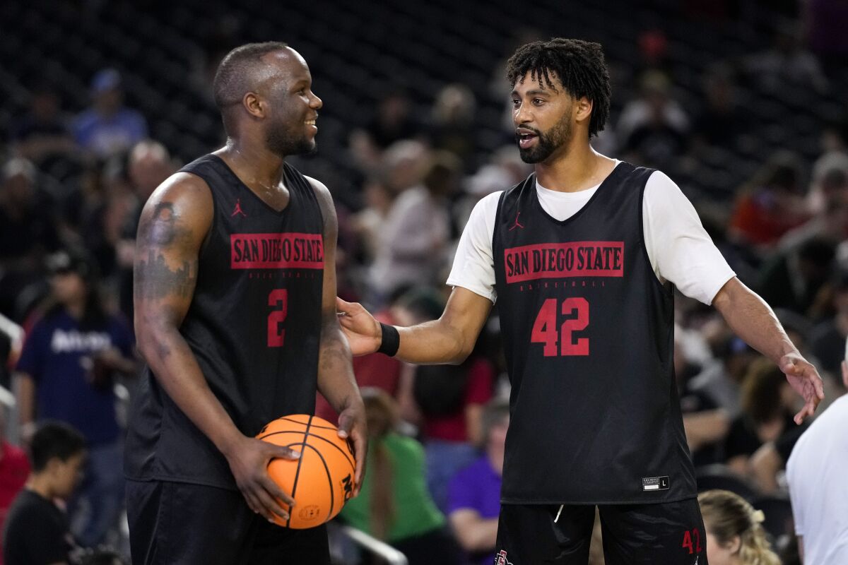 San Diego State guard Adam Seiko, left, and guard Triston Broughton talk during practice for their Final Four college basketball game in the NCAA Tournament on Friday, March 31, 2023, in Houston. San Diego State and Florida Atlantic play on Saturday. (AP Photo/Godofredo A. Vasquez)