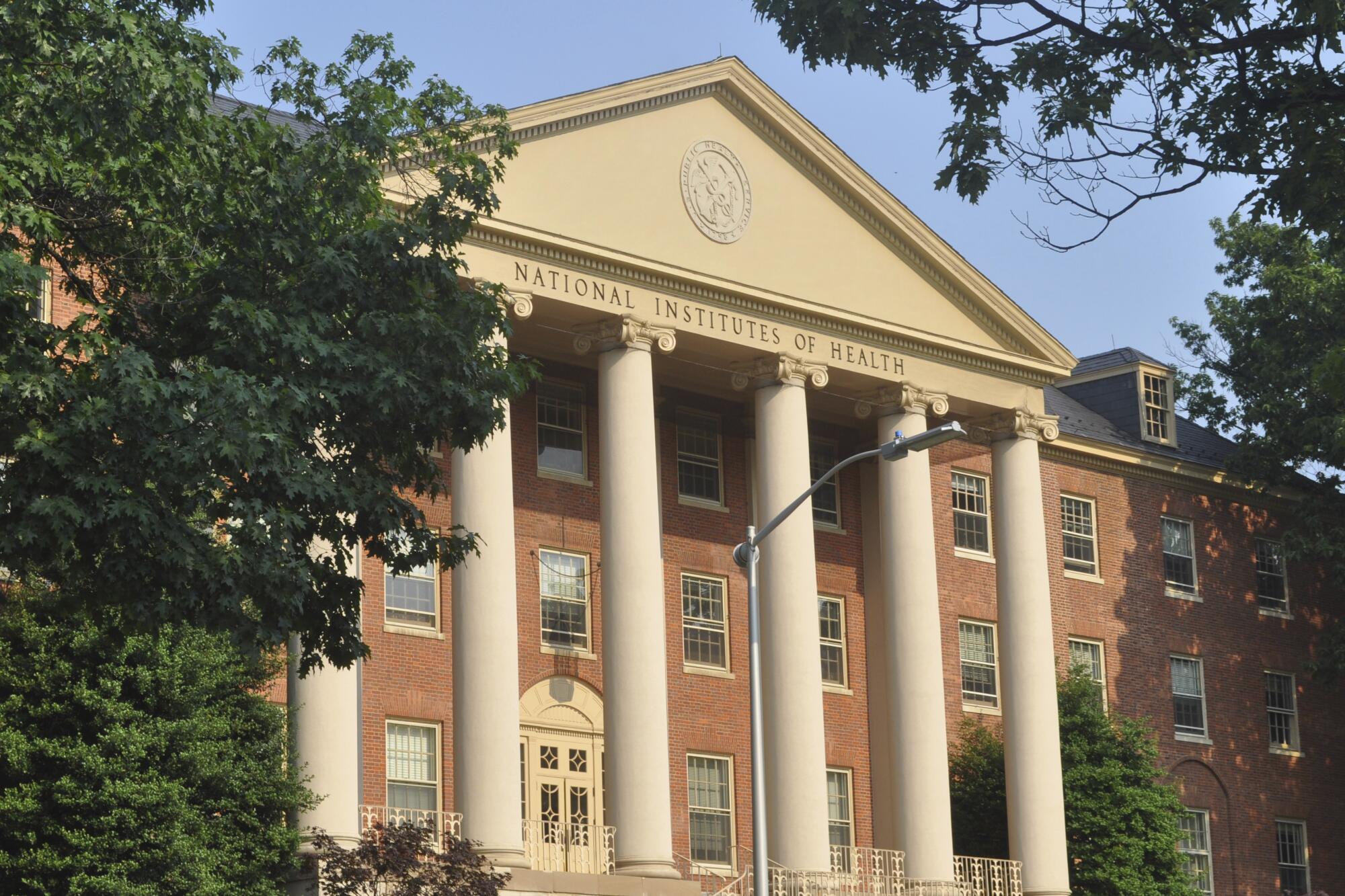 A building, with pillars, marked National Institutes of Health