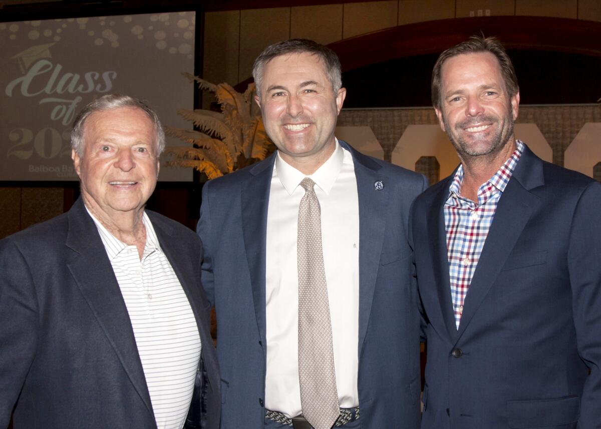  Ron Lane, from left, Newport Harbor High School Principal Sean Bolton and Danny Lane at the scholarship awards event.