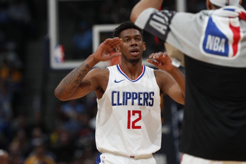 Los Angeles Clippers guard Tyrone Wallace (12) in the second half of an NBA basketball game Tuesday, Feb. 27, 2018, in Denver. The Clippers prevailed 122-120. (AP Photo/David Zalubowski)