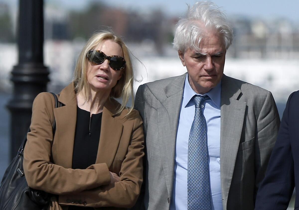 Marcia and Gregory Abbott leave federal court in May. The Abbotts are the sixth and seventh parents to be sentenced in the college admissions scandal.