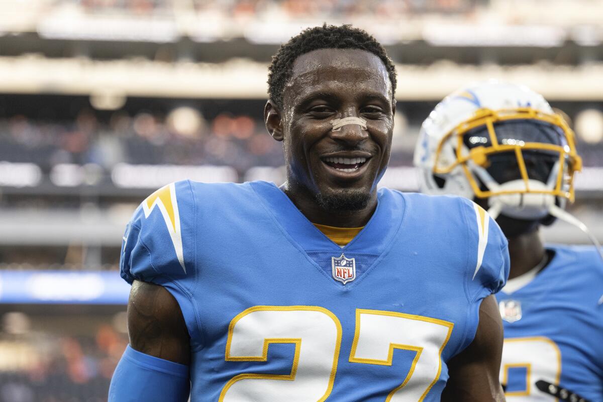 Chargers cornerback J.C. Jackson smiles on the field during pre-game warmups.