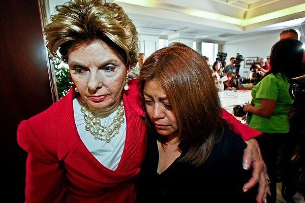 Gloria Allred escorts Nicandra Diaz Santillan, Meg Whitman's former housekeeper, out of a news conference. Allred has denied political motive, saying she was simply helping a woman who was coldly dismissed and says she's owed more than $6,000 in back pay. "I think she wanted to have a voice," Allred says.