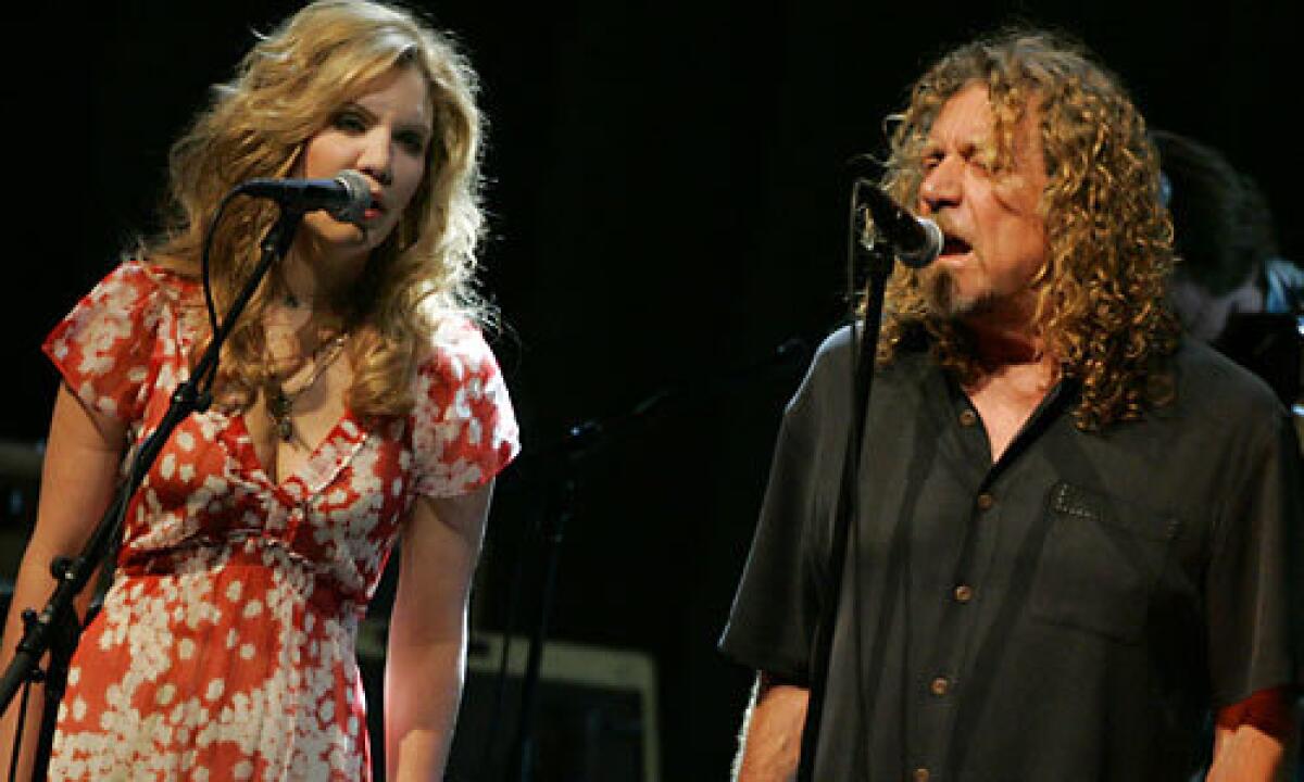 UNLIKELY PAIR: Country-bluegrass star Alison Krauss and rocker Robert Plant at the Greek.