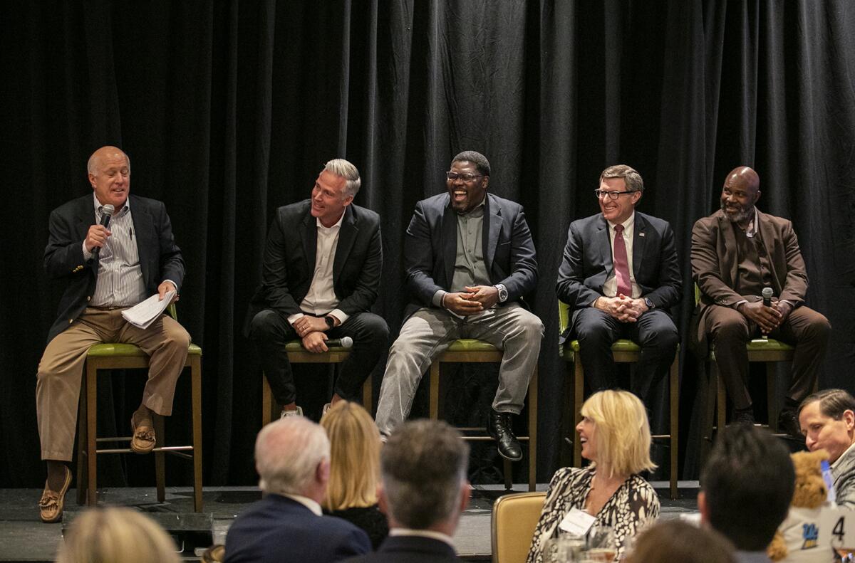 Pat Donahue, left, Wayne Cook, James Washington, Cormac Carney and, Frank Stephens sit on a panel Thursday.