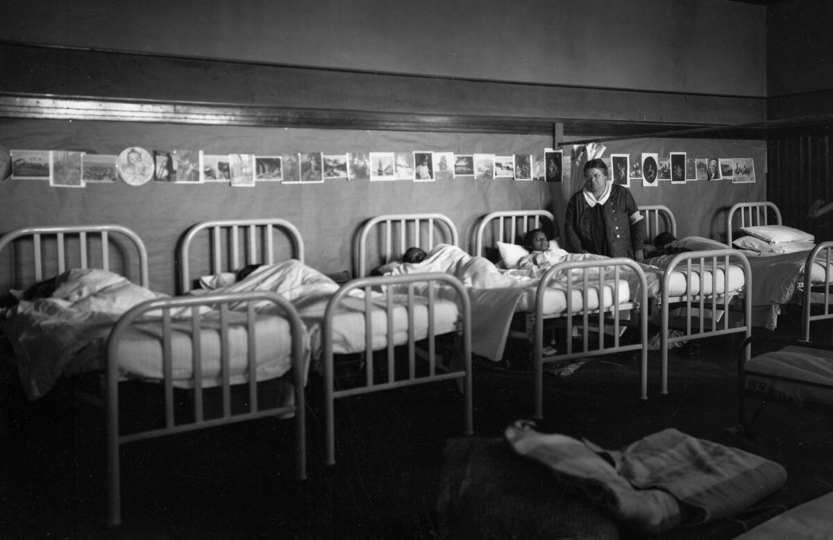 March 1928: Children left homeless by the dam collapse sleep in dormitory.