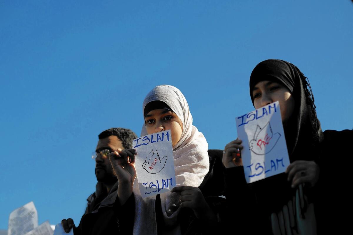 Muslims in Madrid hold placards reading "Islam, Love, Islam" and "Islam, Peace, Islam" during a January demonstration decrying terrorist attacks in Paris.