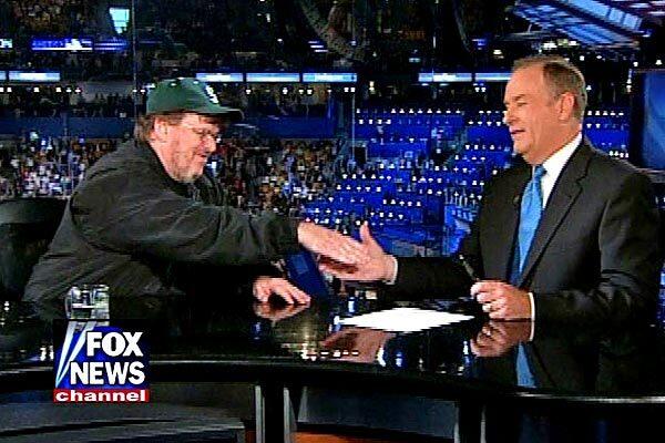 Filmmaker Michael Moore and Bill O'Reilly exchange pleasantries during an interview at the Democratic National Convention in Boston in 2004.