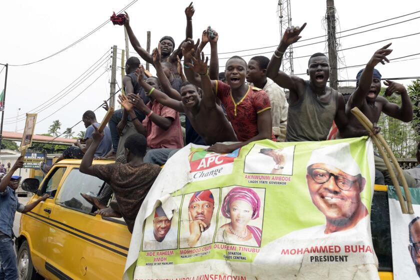 Supporters of newly elected Nigerian President Muhammadu Buhari celebrate in Lagos on Wednesday.