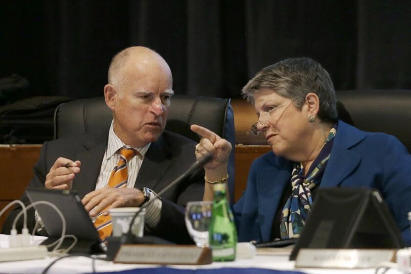 UC President Janet Napolitano talks with Gov. Jerry Brown during a Board of Regents meeting in San Francisco.