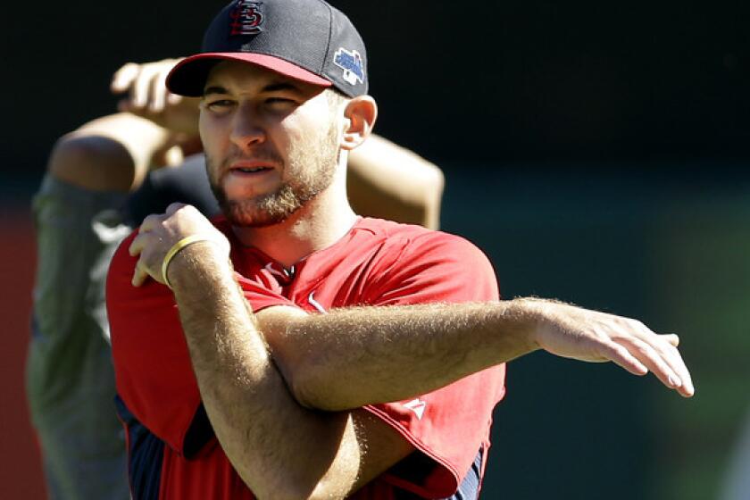 Cardinals pitcher Michael Wacha stretches during a workout Tuesday in St. Louis.