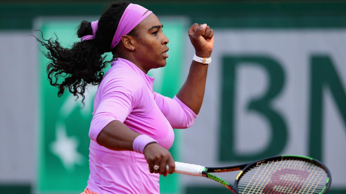 Serena Williams celebrates a point during her victory over Victoria Azarenka at the French Open on May 30, 2015. With the win, Williams became the first woman in the Open era to achieve 50 or more wins in all four Grand Slams.