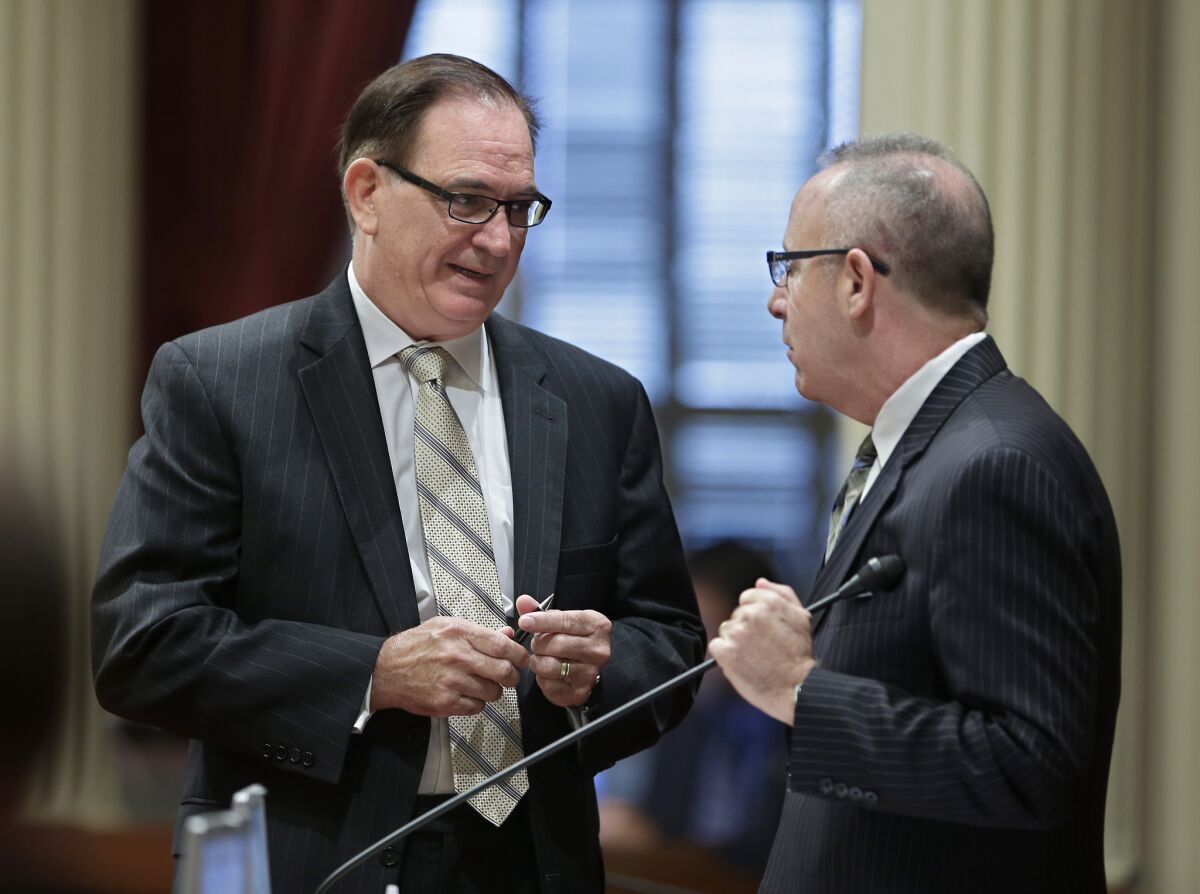 Senate Minority Leader Bob Huff, R-Diamond Bar, left, meets with Senate President Pro Tem Darrell Steinberg, D-Sacramento, during the Senate session earlier this month. Huff was the main sponsor of a foster care bill signed Thursday by Gov. Jerry Brown.