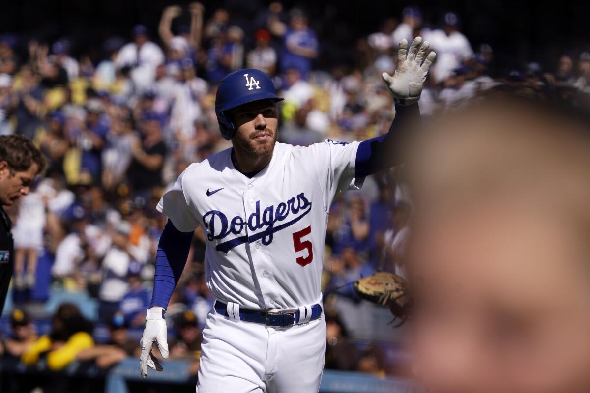 The Dodgers' Freddie Freeman waves to fans after hitting a solo home run during the first inning July 2, 2022.