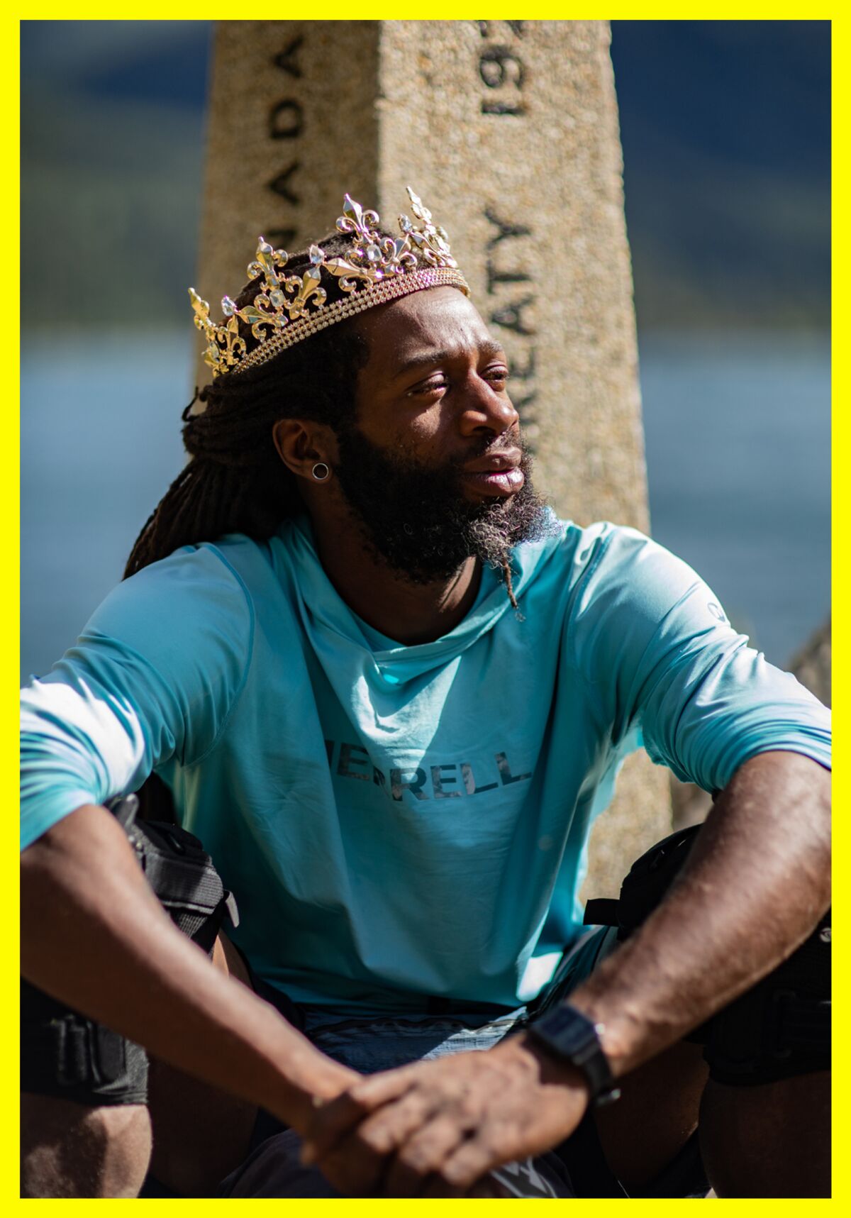 Akuna Robinson, wearing a crown, poses for a photo