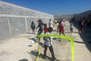 Children play soccer at the Sidewalk School in Matamoros, Mexico.