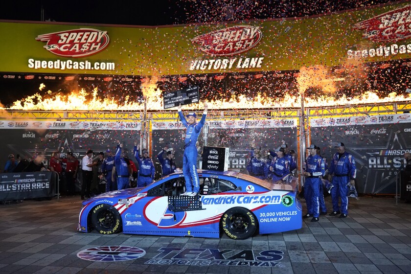 Kyle Larson celebrates in Victory Lane after winning the NASCAR Cup Series All-Star auto race at Texas Motor Speedway in Fort Worth, Texas, Sunday, June 13, 2021. (AP Photo/Tony Gutierrez)