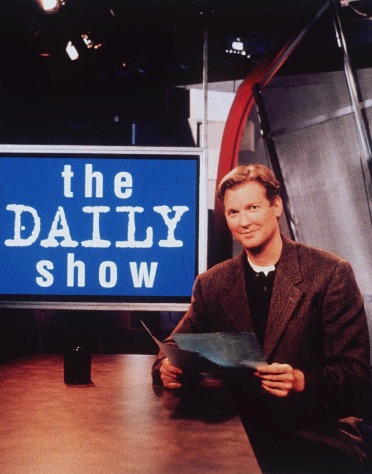 Craig Kilborn, the first host of “The Daily Show,” poses on set in 1997.