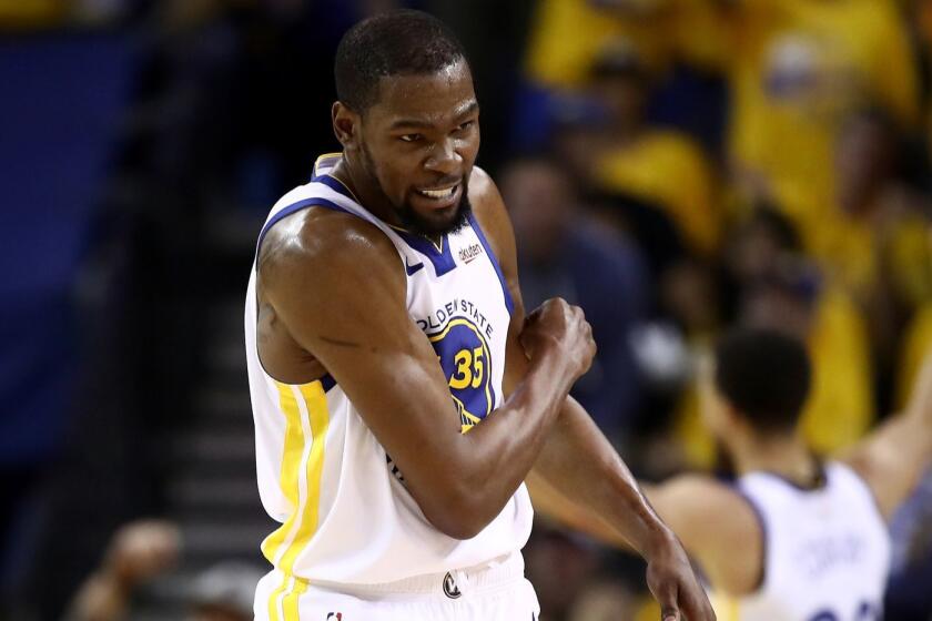 OAKLAND, CALIFORNIA - MAY 08: Kevin Durant #35 of the Golden State Warriors reacts after the Warriors scored a basket against the Houston Rockets during Game Five of the Western Conference Semifinals of the 2019 NBA Playoffs at ORACLE Arena on May 08, 2019 in Oakland, California. NOTE TO USER: User expressly acknowledges and agrees that, by downloading and or using this photograph, User is consenting to the terms and conditions of the Getty Images License Agreement. (Photo by Ezra Shaw/Getty Images) ** OUTS - ELSENT, FPG, CM - OUTS * NM, PH, VA if sourced by CT, LA or MoD **