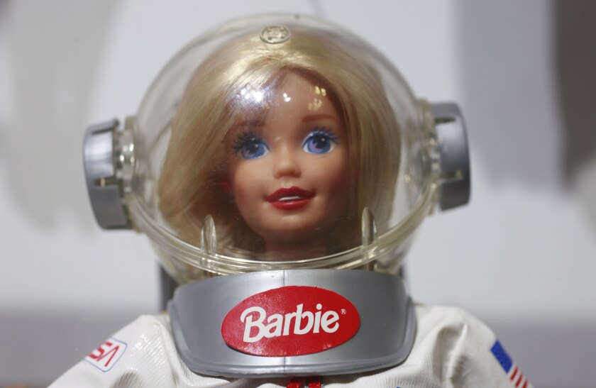 A Barbie doll in an astronaut suit.