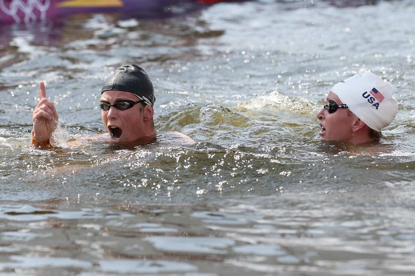 Eva Risztov of Hungary, left, celebrates after winning the gold medal alongside silver medalist Haley Anderson of the United States in the women's open-water swimming marathon.